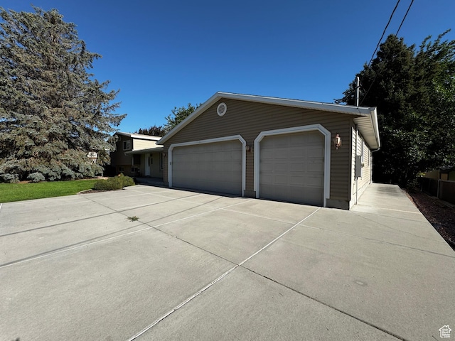 500 W Clark St S, Grantsville, UT 84029 - view of side of property with a garage and concrete driveway