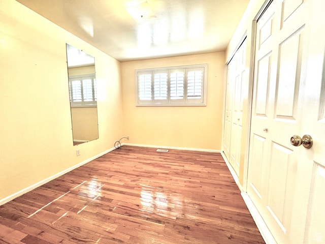 500 W Clark St S, Grantsville, UT 84029 - unfurnished bedroom with baseboards, wood finished floors, and a closet