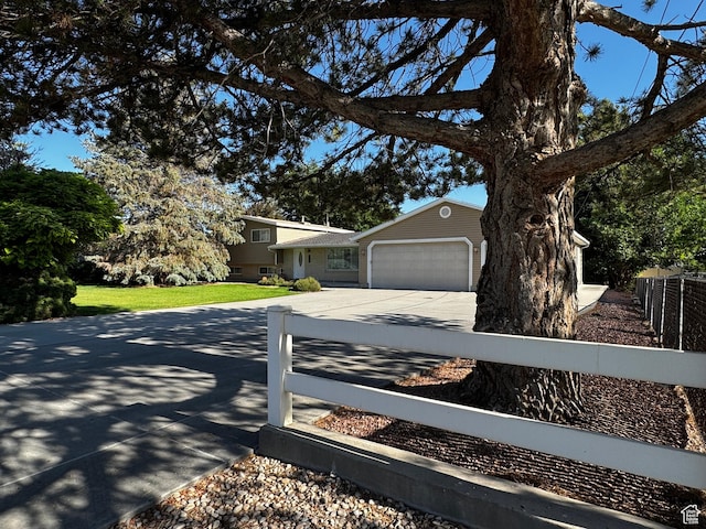 500 W Clark St S, Grantsville, UT 84029 - view of front facade featuring driveway and a garage