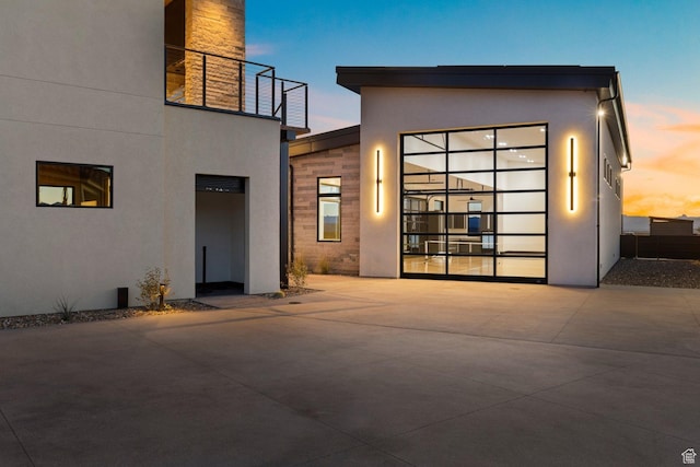 20 N Cliffside Dr, Washington, UT 84780 - back of house at dusk featuring stucco siding