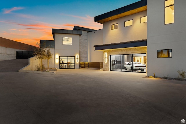 20 N Cliffside Dr, Washington, UT 84780 - back of property featuring stone siding and stucco siding