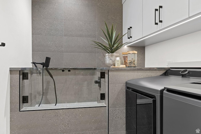 20 N Cliffside Dr, Washington, UT 84780 - washroom with washing machine and dryer and cabinet space