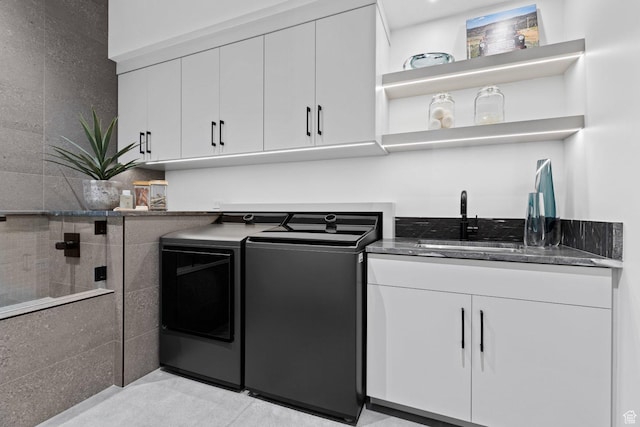 20 N Cliffside Dr, Washington, UT 84780 - washroom with washer and dryer, cabinet space, and a sink