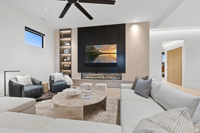 20 N Cliffside Dr, Washington, UT 84780 - living room featuring a tiled fireplace, built in features, wood finished floors, and recessed lighting