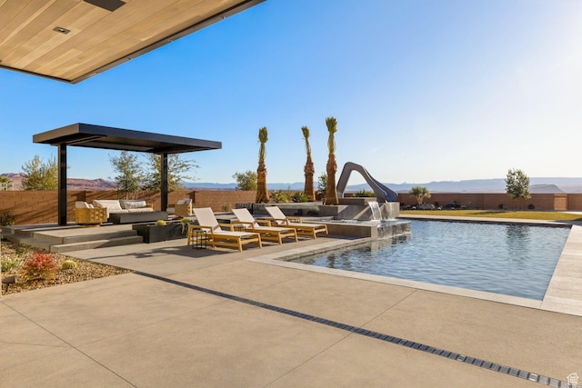 20 N Cliffside Dr, Washington, UT 84780 - view of pool featuring a fenced in pool, an outdoor hangout area, fence, a patio area, and a mountain view