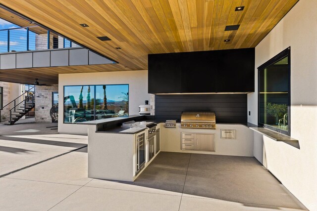 20 N Cliffside Dr, Washington, UT 84780 - view of patio featuring stairs, an outdoor kitchen, and a grill