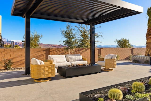 20 N Cliffside Dr, Washington, UT 84780 - view of patio / terrace with an outdoor living space with a fire pit, a fenced backyard, a mountain view, and a pergola