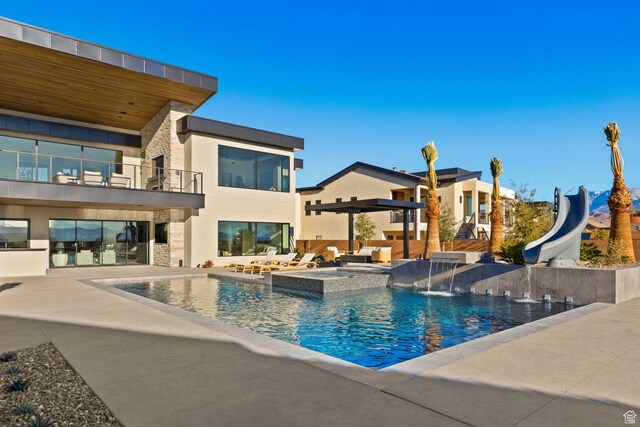 20 N Cliffside Dr, Washington, UT 84780 - view of pool featuring a patio area, a pool with connected hot tub, and a water slide