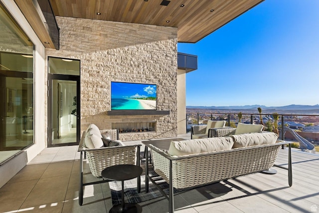 20 N Cliffside Dr, Washington, UT 84780 - view of patio / terrace with an outdoor living space with a fireplace