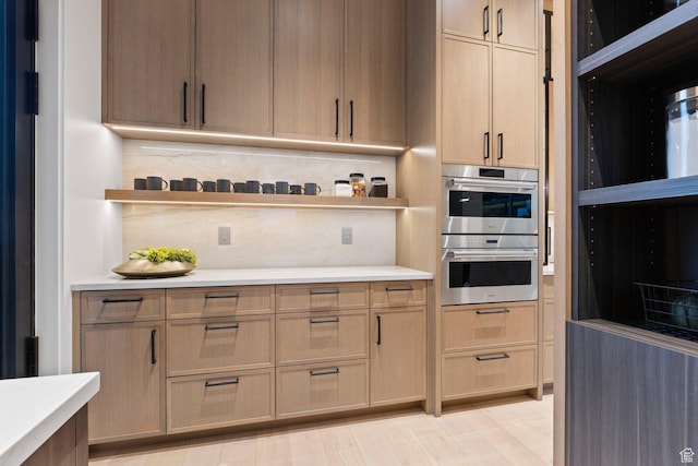 20 N Cliffside Dr, Washington, UT 84780 - kitchen with backsplash, open shelves, stainless steel double oven, and light countertops