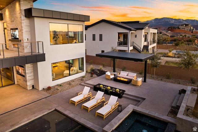 20 N Cliffside Dr, Washington, UT 84780 - rear view of property with a balcony, a patio area, outdoor lounge area, and stucco siding