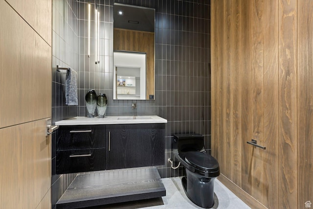 20 N Cliffside Dr, Washington, UT 84780 - bathroom with toilet, tile walls, and vanity