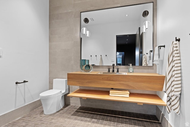 20 N Cliffside Dr, Washington, UT 84780 - bathroom with vanity, toilet, and tile patterned floors