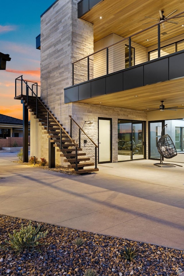 20 N Cliffside Dr, Washington, UT 84780 - property entrance featuring a balcony, stone siding, and a ceiling fan