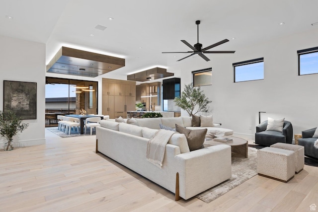 20 N Cliffside Dr, Washington, UT 84780 - living area featuring light wood finished floors, ceiling fan, and a wealth of natural light