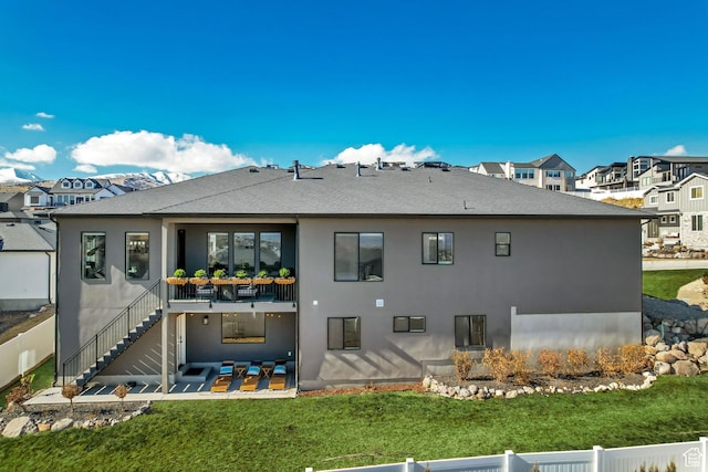 14203 S Brook Heights Cir W, Herriman, UT 84096 - rear view of property with a lawn and a patio