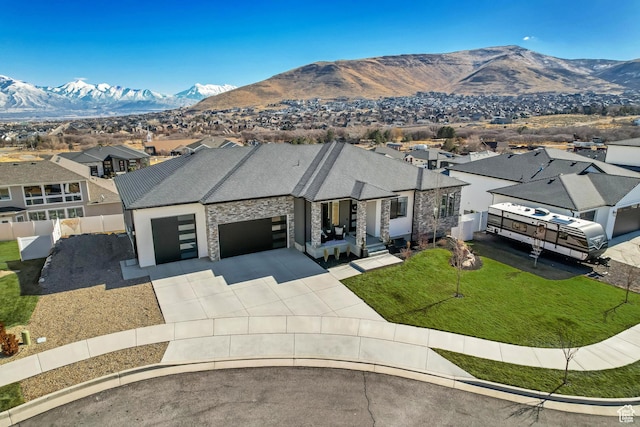 14203 S Brook Heights Cir W, Herriman, UT 84096 - ranch-style home with a garage, a mountain view, and a front yard