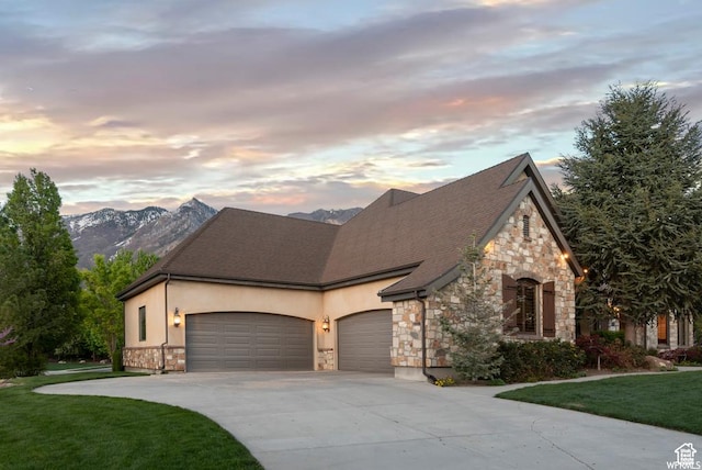 view of front of house with a garage and a mountain view
