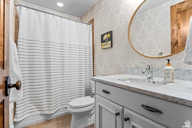 full bathroom with shower / bathtub combination with curtain, vanity, a textured ceiling, tile patterned floors, and toilet