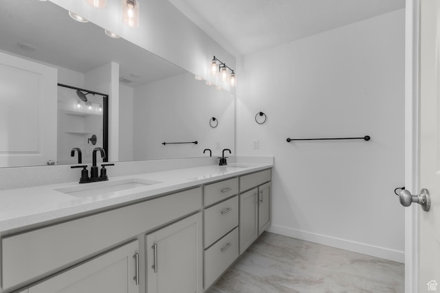bathroom with vanity and a shower with shower door