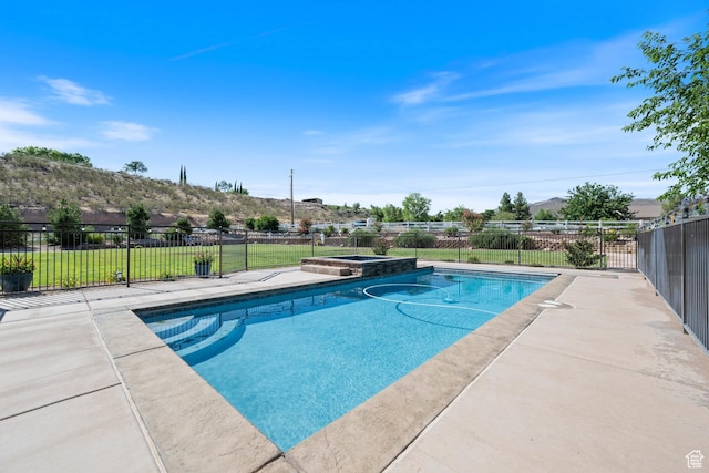 1512 Cholla Dr, Toquerville, UT 84774 - view of swimming pool featuring a pool with connected hot tub, a patio area, and a mountain view