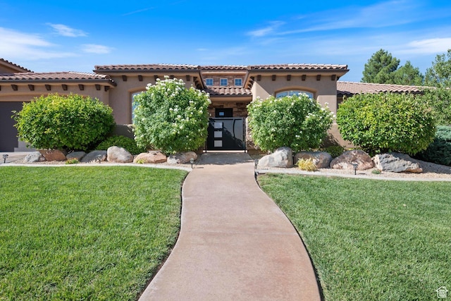 1512 Cholla Dr, Toquerville, UT 84774 - mediterranean / spanish house with stucco siding, a front lawn, and a tiled roof