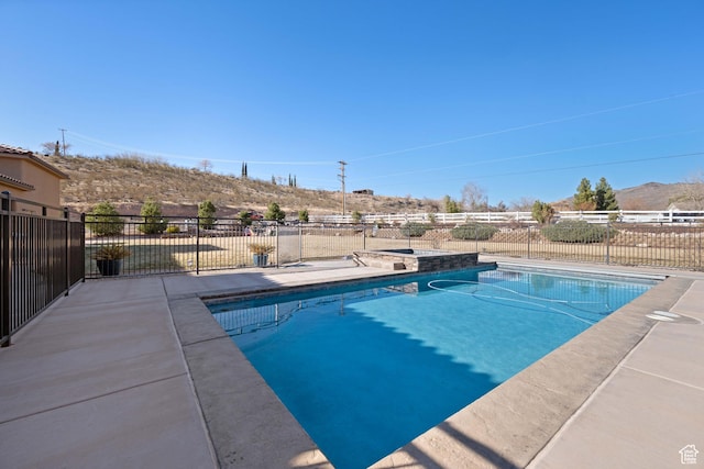 view of swimming pool featuring a mountain view