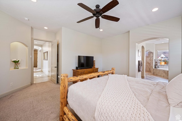 bedroom featuring light colored carpet and ceiling fan