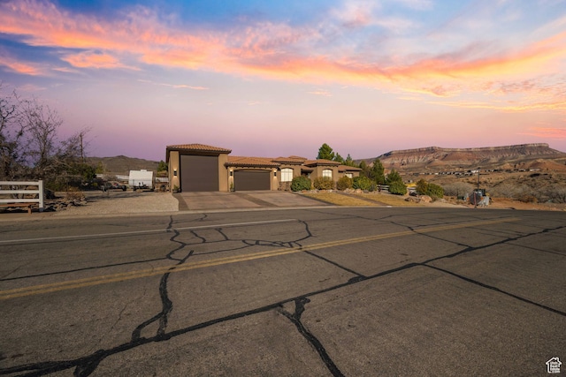 view of front of house with a garage and a mountain view