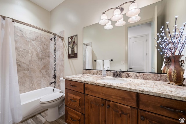 full bathroom with vanity, hardwood / wood-style flooring, toilet, and shower / bath combo
