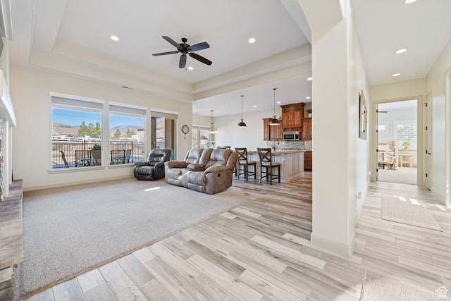 1512 Cholla Dr, Toquerville, UT 84774 - living area featuring a ceiling fan, light wood-type flooring, recessed lighting, and arched walkways