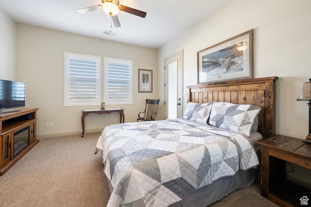 bedroom with ceiling fan and light colored carpet