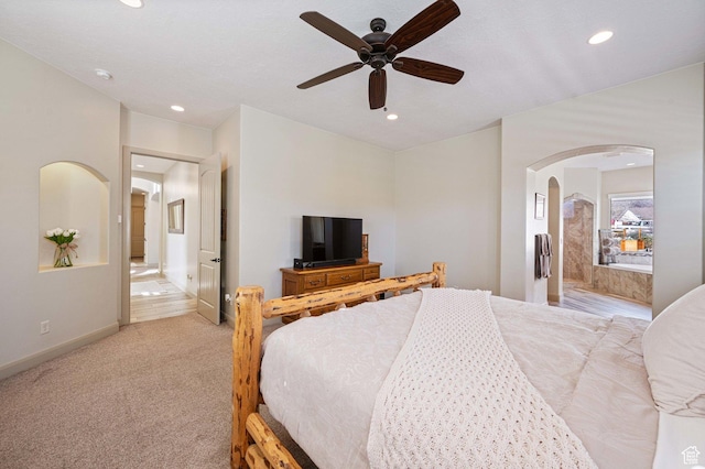 1512 Cholla Dr, Toquerville, UT 84774 - bedroom featuring arched walkways, recessed lighting, light carpet, and ceiling fan