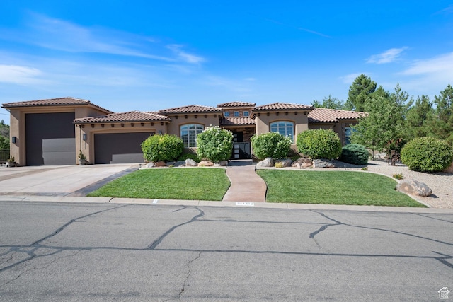 1512 Cholla Dr, Toquerville, UT 84774 - mediterranean / spanish home featuring stucco siding, a garage, a tiled roof, and a front lawn