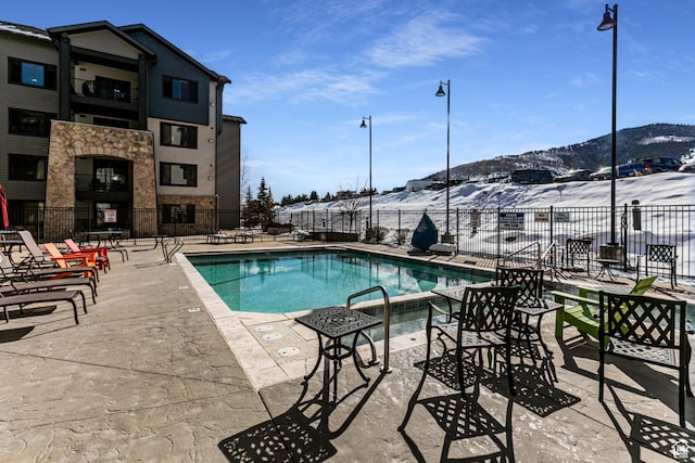 2669 N Canyons Resort Dr W Unit 205, Park City, UT 84098 - pool with a patio, fence, and a mountain view