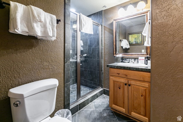 2669 N Canyons Resort Dr W Unit 205, Park City, UT 84098 - bathroom with toilet, a stall shower, vanity, and a textured wall
