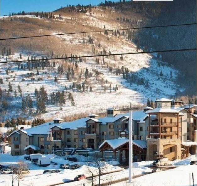 2669 N Canyons Resort Dr W Unit 205, Park City, UT 84098 - snowy aerial view with a residential view and a mountain view