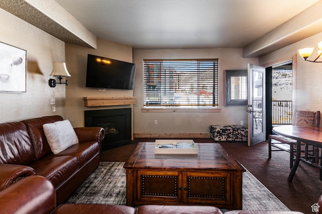 2669 N Canyons Resort Dr W Unit 205, Park City, UT 84098 - living room featuring a chandelier, dark carpet, and a fireplace