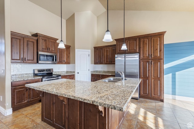 11513 S Jackson Downs Way S, Jordan, UT 84095 - kitchen with stainless steel appliances, an island with sink, sink, and decorative light fixtures