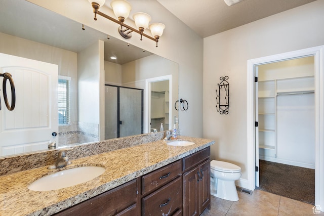 11513 S Jackson Downs Way S, Jordan, UT 84095 - bathroom featuring vanity, toilet, a shower with shower door, and tile patterned flooring