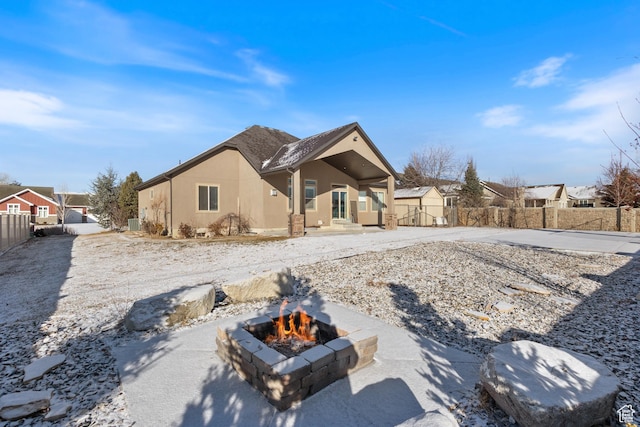 11513 S Jackson Downs Way S, Jordan, UT 84095 - back of house featuring a storage unit and a fire pit