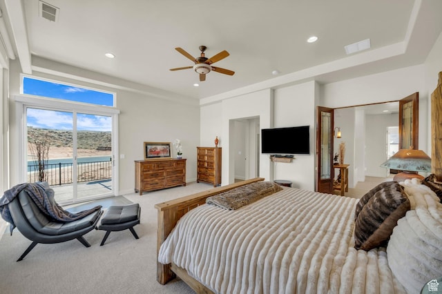bedroom featuring access to outside, light carpet, visible vents, and recessed lighting