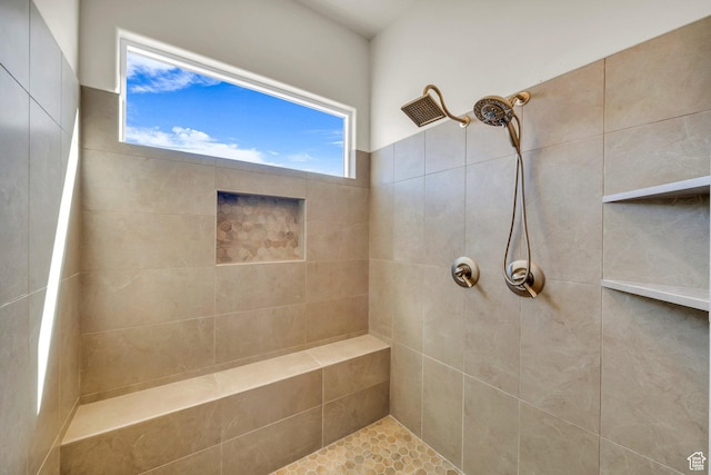full bathroom with tiled shower