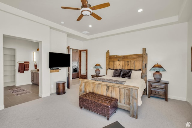 bedroom featuring baseboards, ceiling fan, recessed lighting, connected bathroom, and light colored carpet