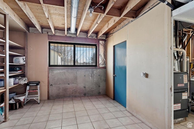 basement with light tile patterned flooring