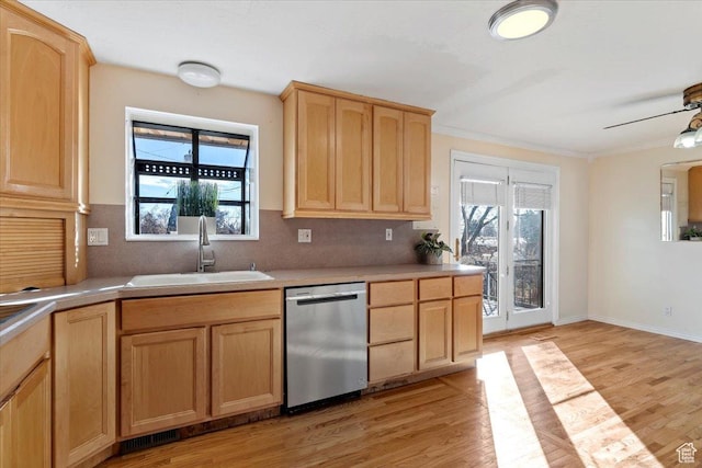 kitchen with sink, stainless steel dishwasher, light hardwood / wood-style floors, and light brown cabinets