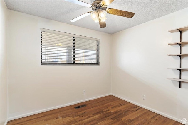 spare room featuring hardwood / wood-style flooring, ceiling fan, and a textured ceiling