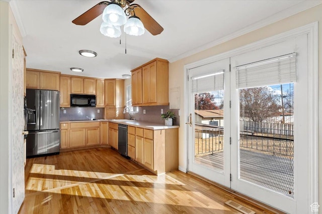 kitchen featuring dishwasher, sink, backsplash, light brown cabinets, and fridge with ice dispenser