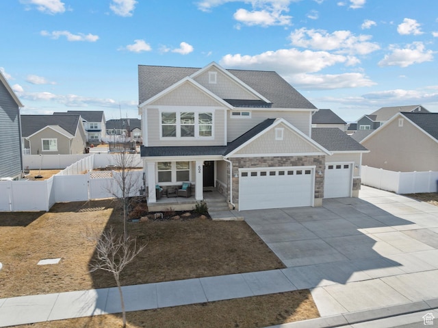 view of front of home with a garage and covered porch