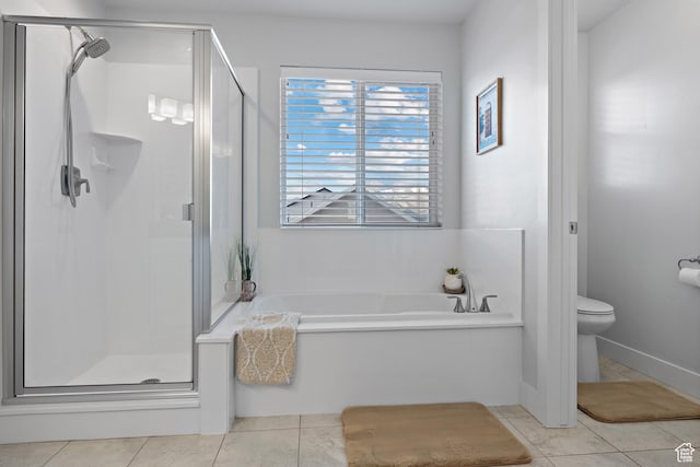 full bathroom with a shower stall, tile patterned flooring, a garden tub, and toilet